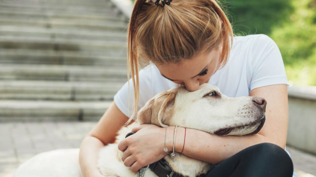 woman with labrador retriever emotional support animal