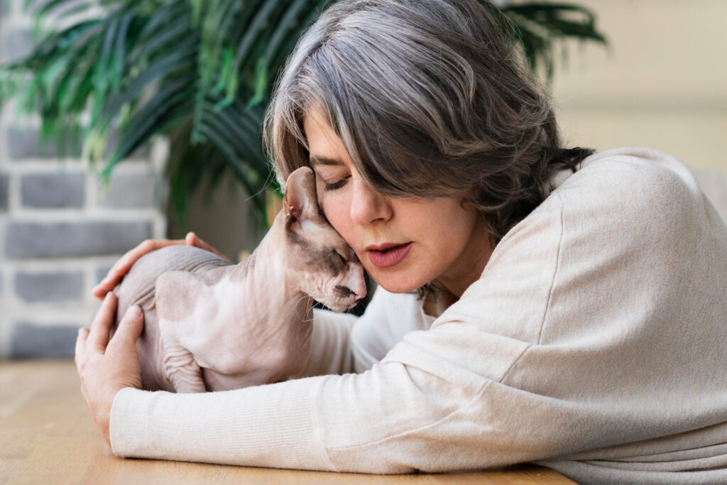 Woman and cat being affectionate