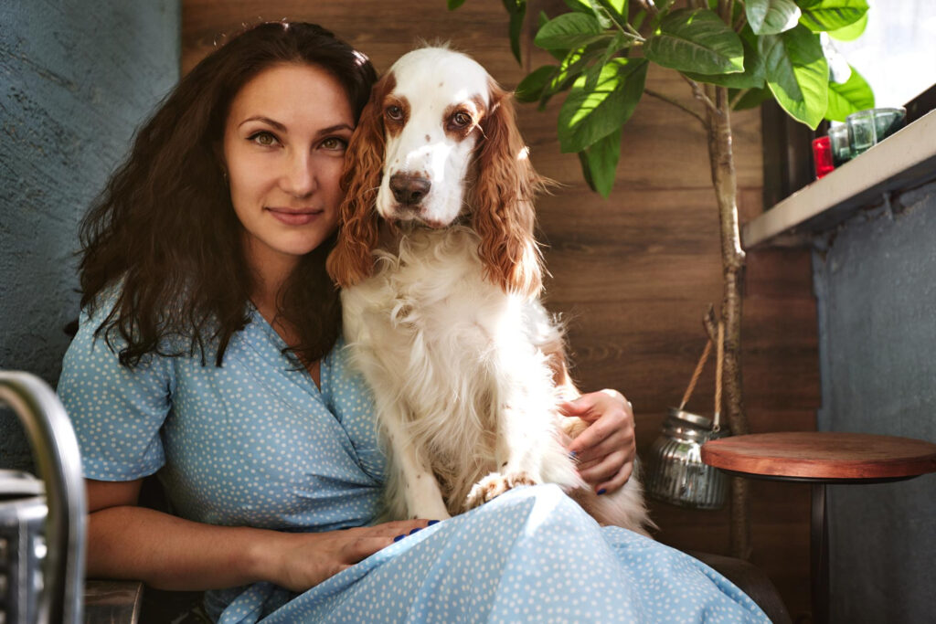 woman with emotional support dog on lap