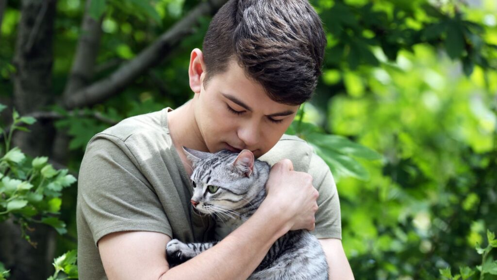 guy with esa cat in arms