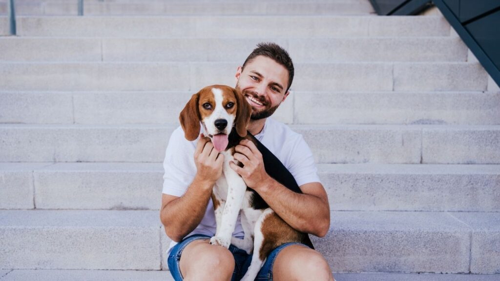 guy on steps with dog