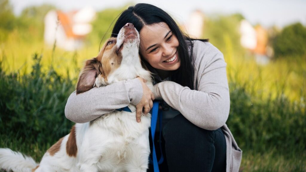 woman hugging dog