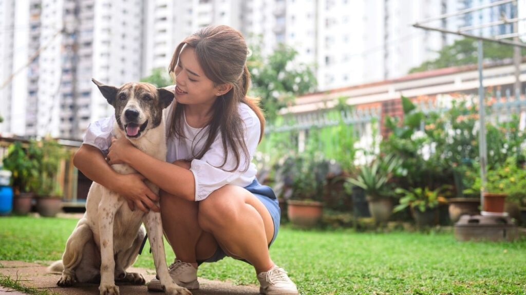 woman outside with dog