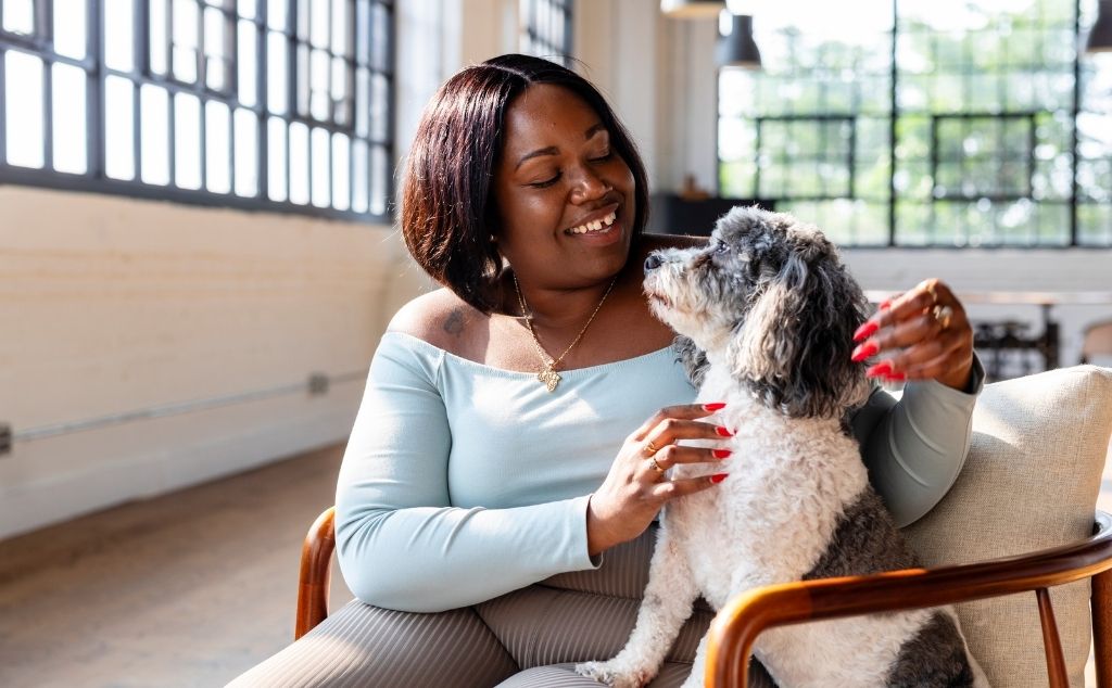 middle woman with emotional support dog