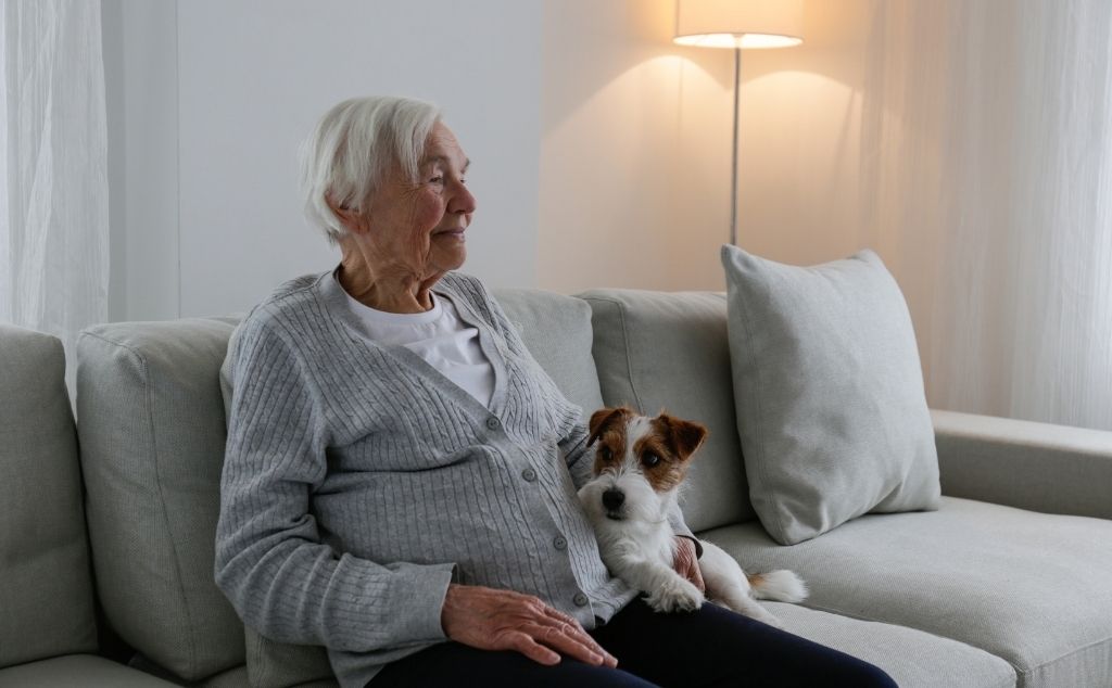 old woman with emotional support dog