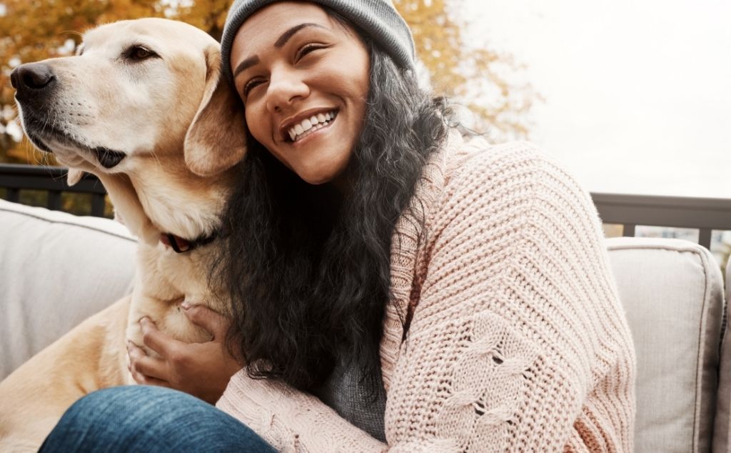 woman hugging emotional support dog