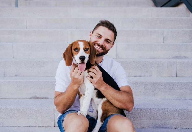 guy on steps with dog