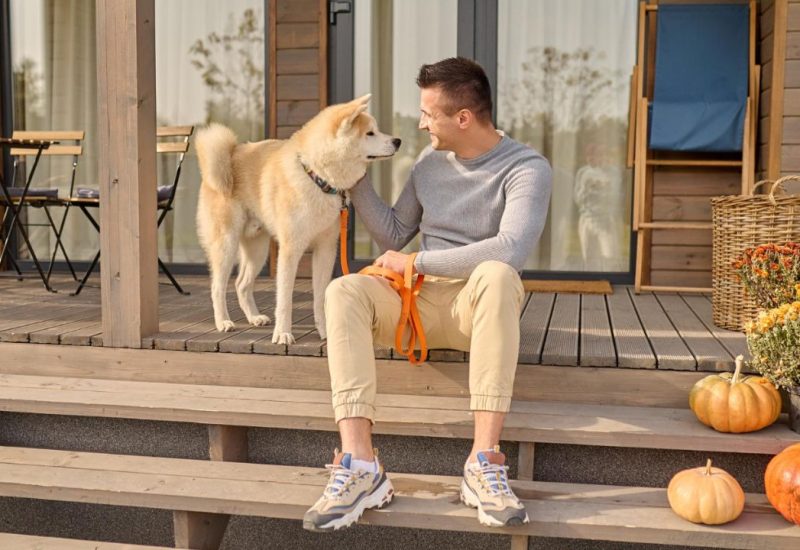 guy with dog on porch