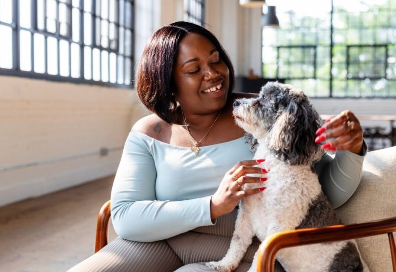 middle woman with emotional support dog