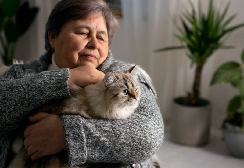 older woman with cat