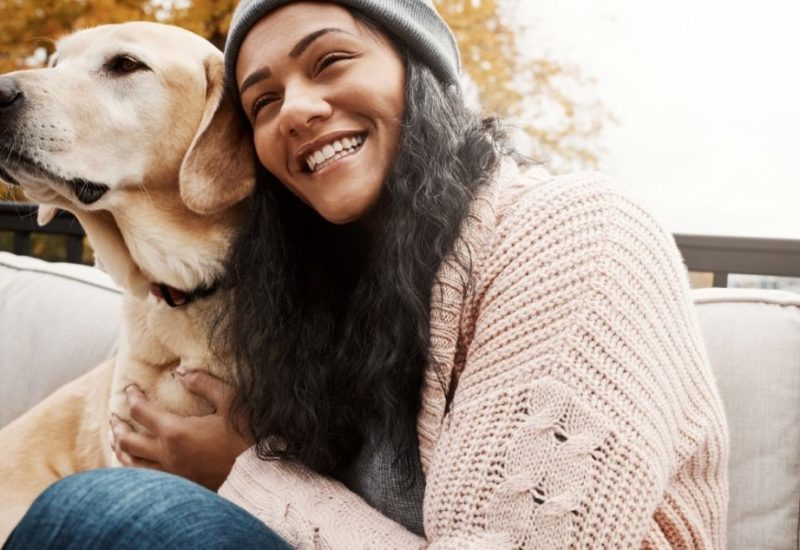 woman hugging emotional support dog