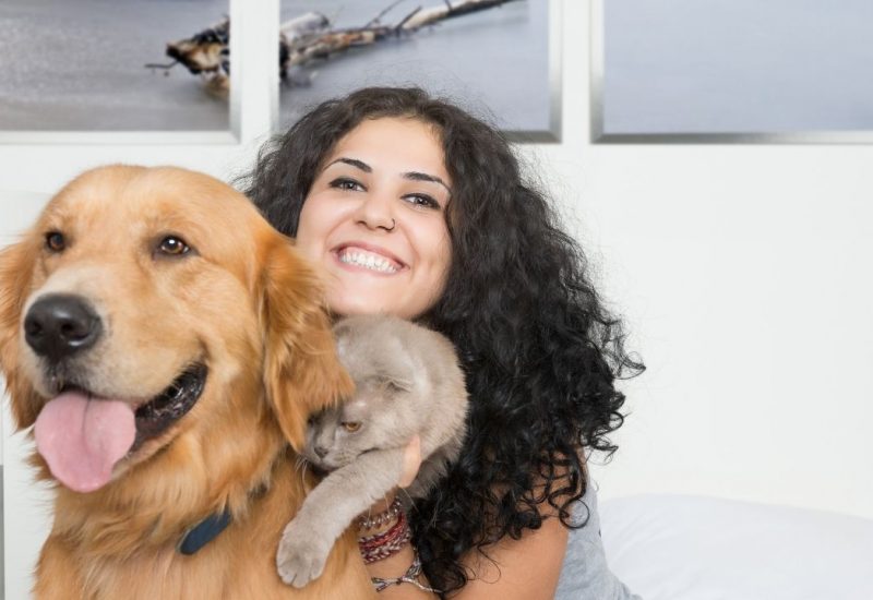 woman with dog and cat